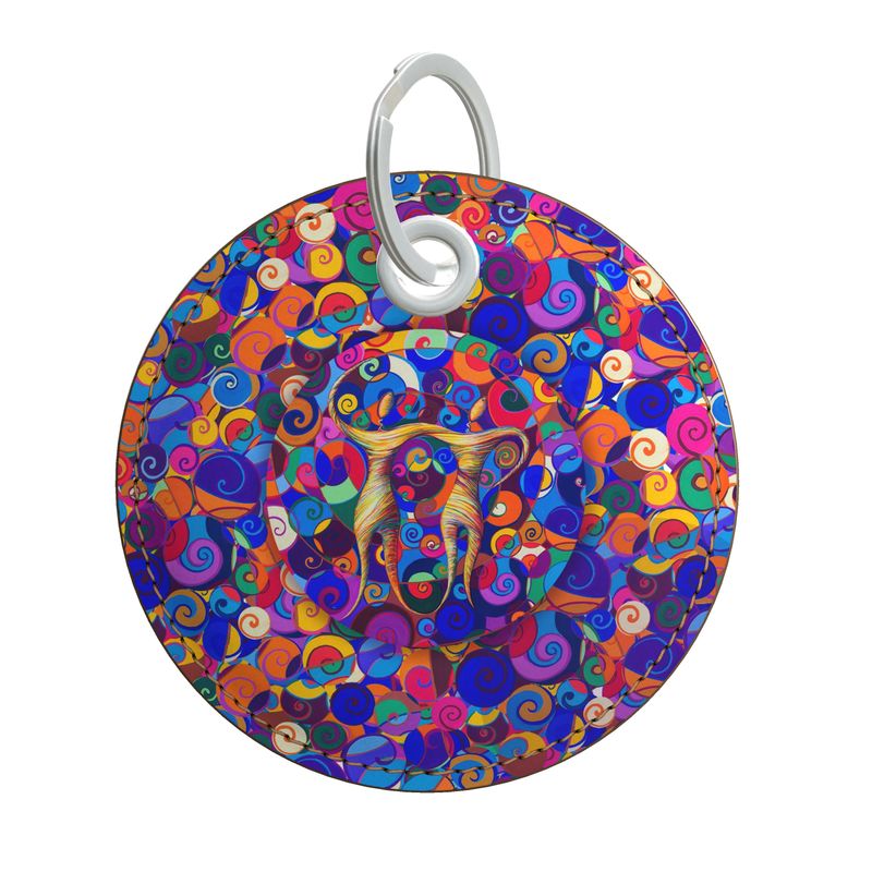  Designer-Schlüsselanhänger Sternzeichen Zwillinge mit buntem Hintergrund aus zahllosen Spiralen, runde Form aus hochwertigem Nappaleder mit grauen Nähten und silbernen Metallteilen